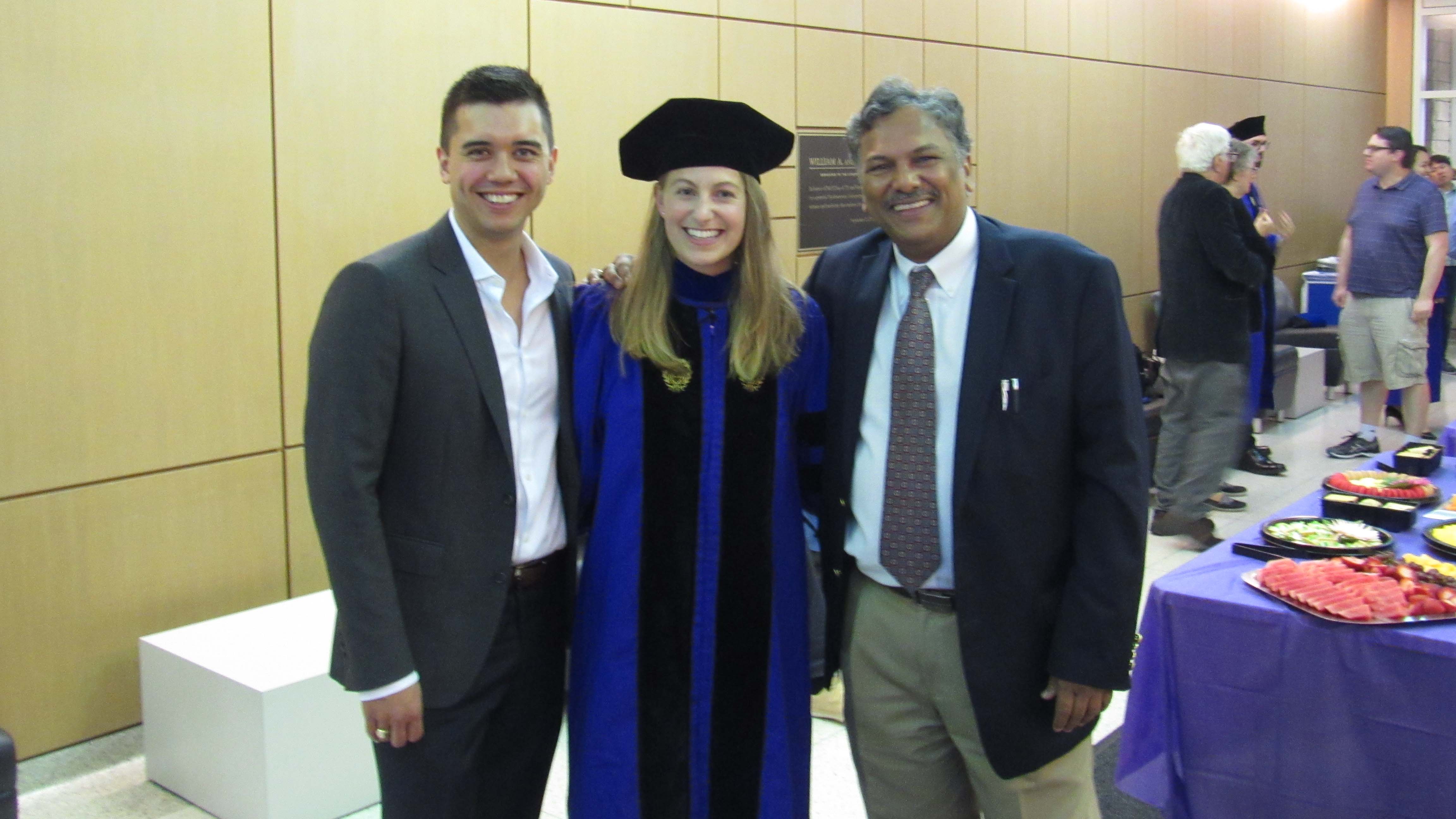 Eve Hanson, center, with boyfriend Dean and professor Dravid at a commencement celebration in Cook Hall.