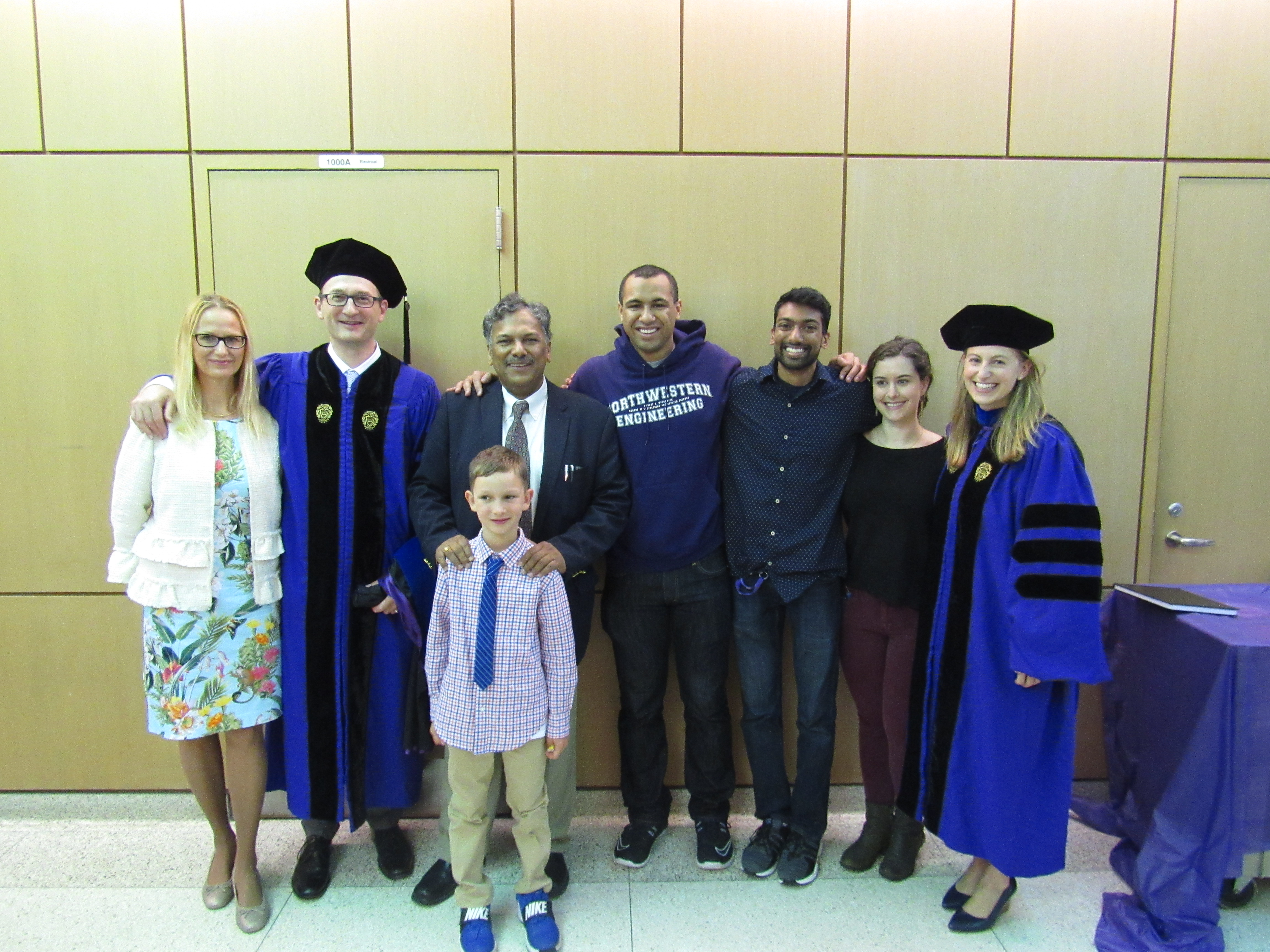The graduates pose with members of VPD Group and the Myers family. Left to right: Dorota Myers, Ben Myers, Max Myers, Vinayak Dravid, Jann Grovogui, Akshay Murtha, Jenn DiStefano, Eve Hanson