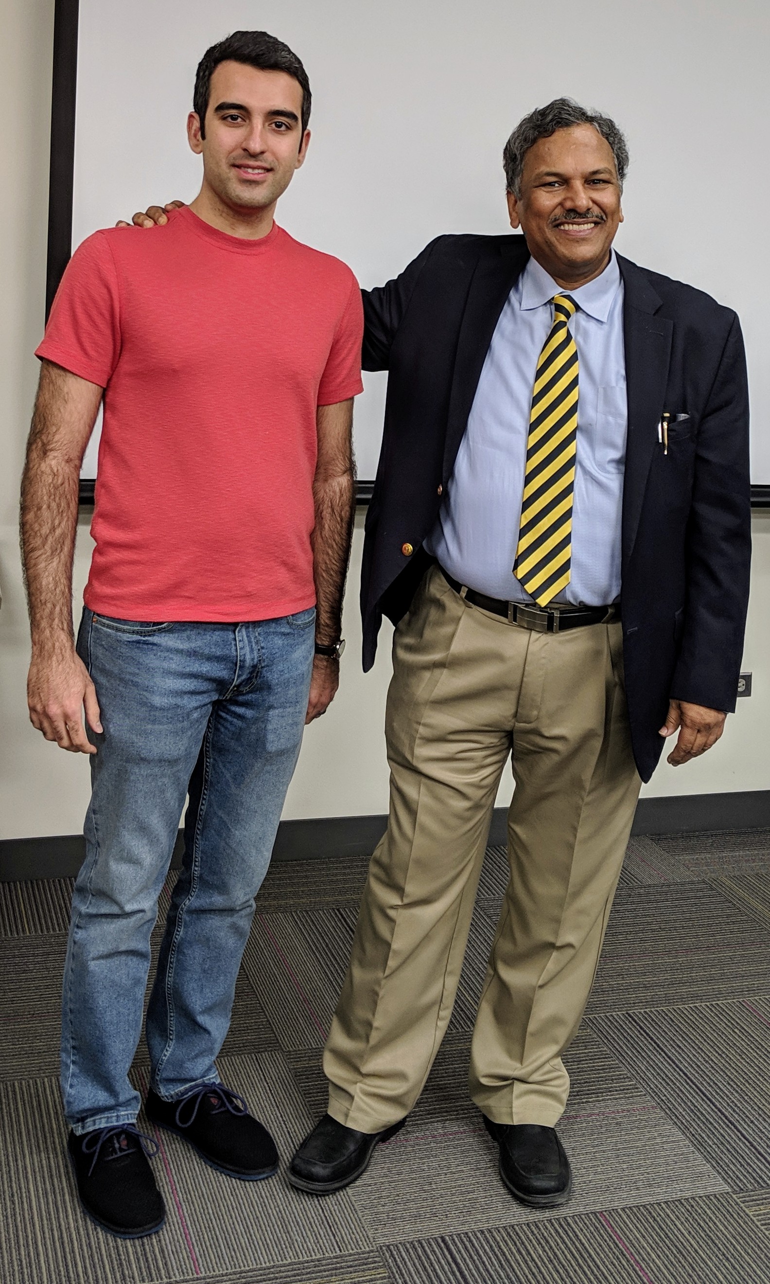 Dr. Yasaei poses with professor Dravid at his going away party.