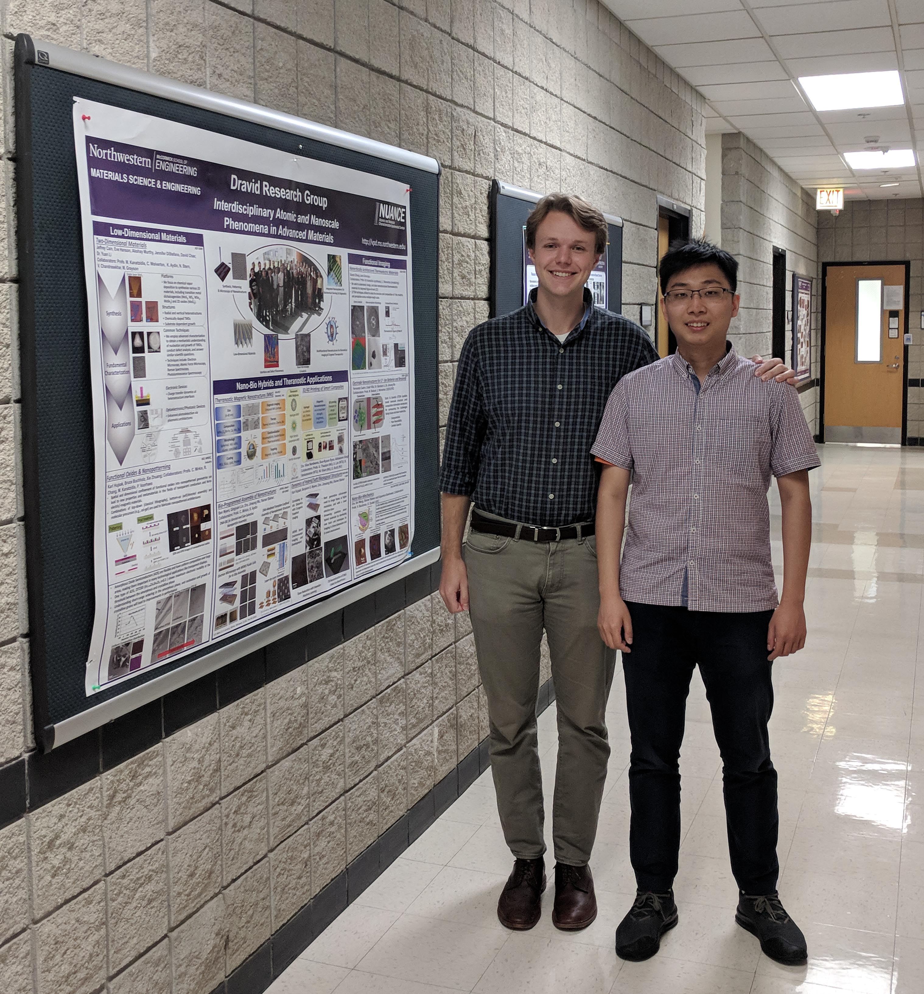 Kaiser and Du pose next to Kaiser's research poster in Cook Hall.