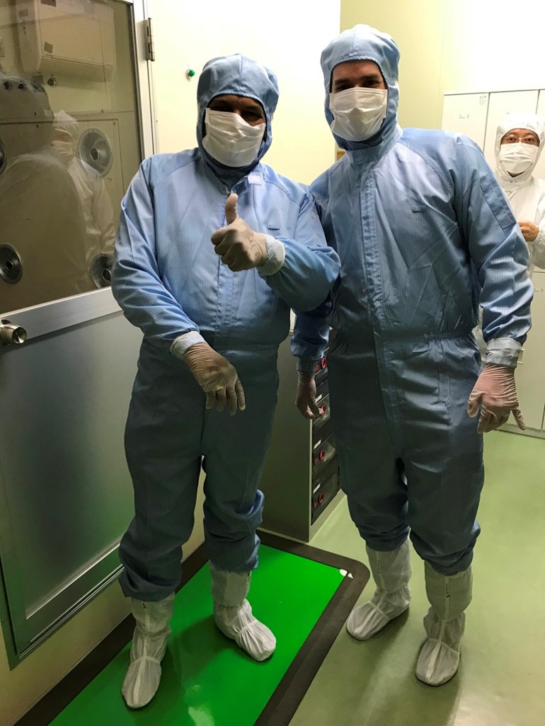 Professor Dravid, left, with JEOL's Patrick Phillips, suited up to enter JEOL's cleanroom