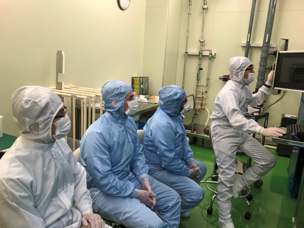 Professor Dravid, second from right, got to see the JBX-8100FS model in the cleanroom