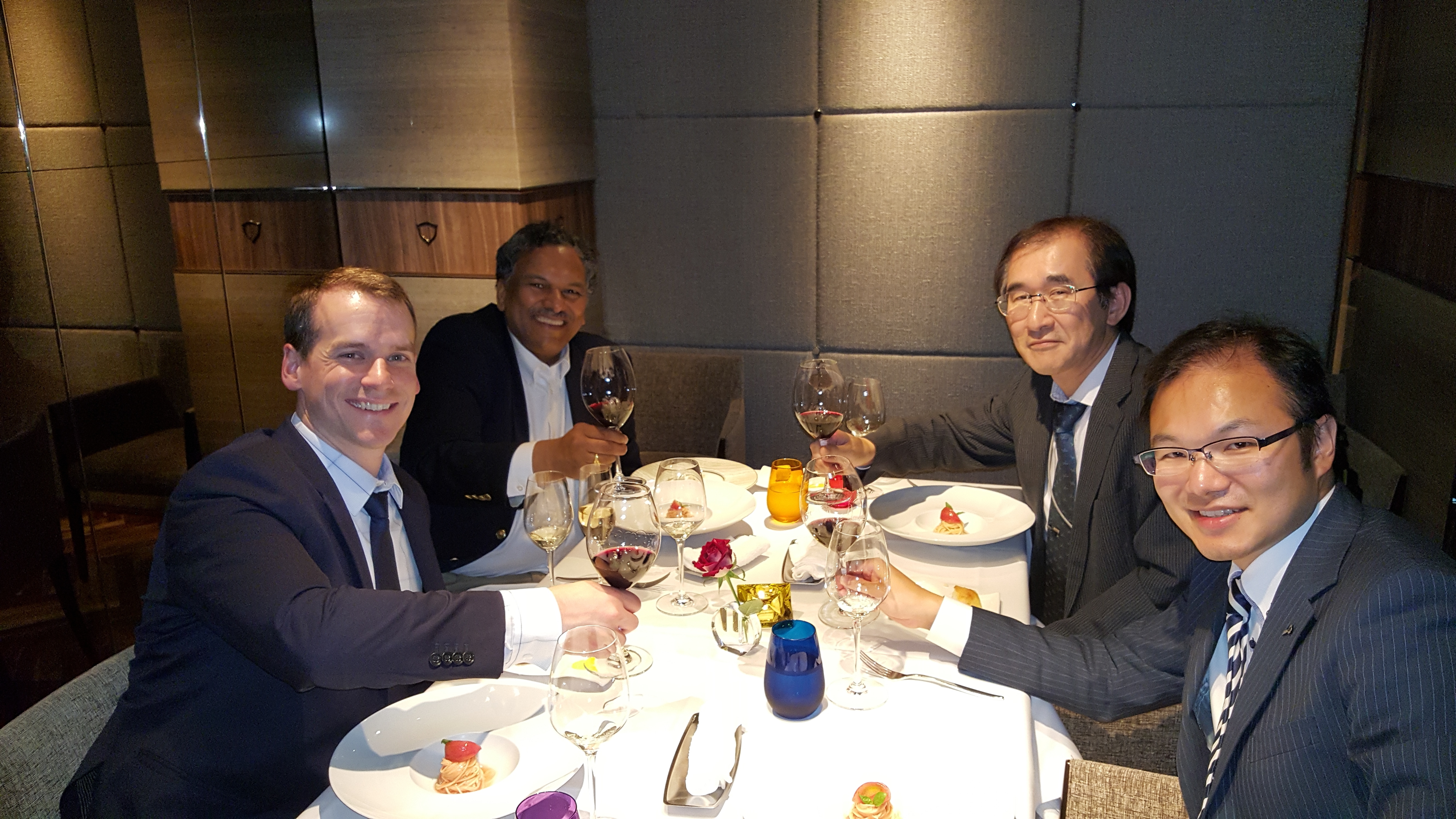 Professor Dravid, JEOL USA's Patrick Phillips and two Japanese JEOL executives toast over a formal dinner