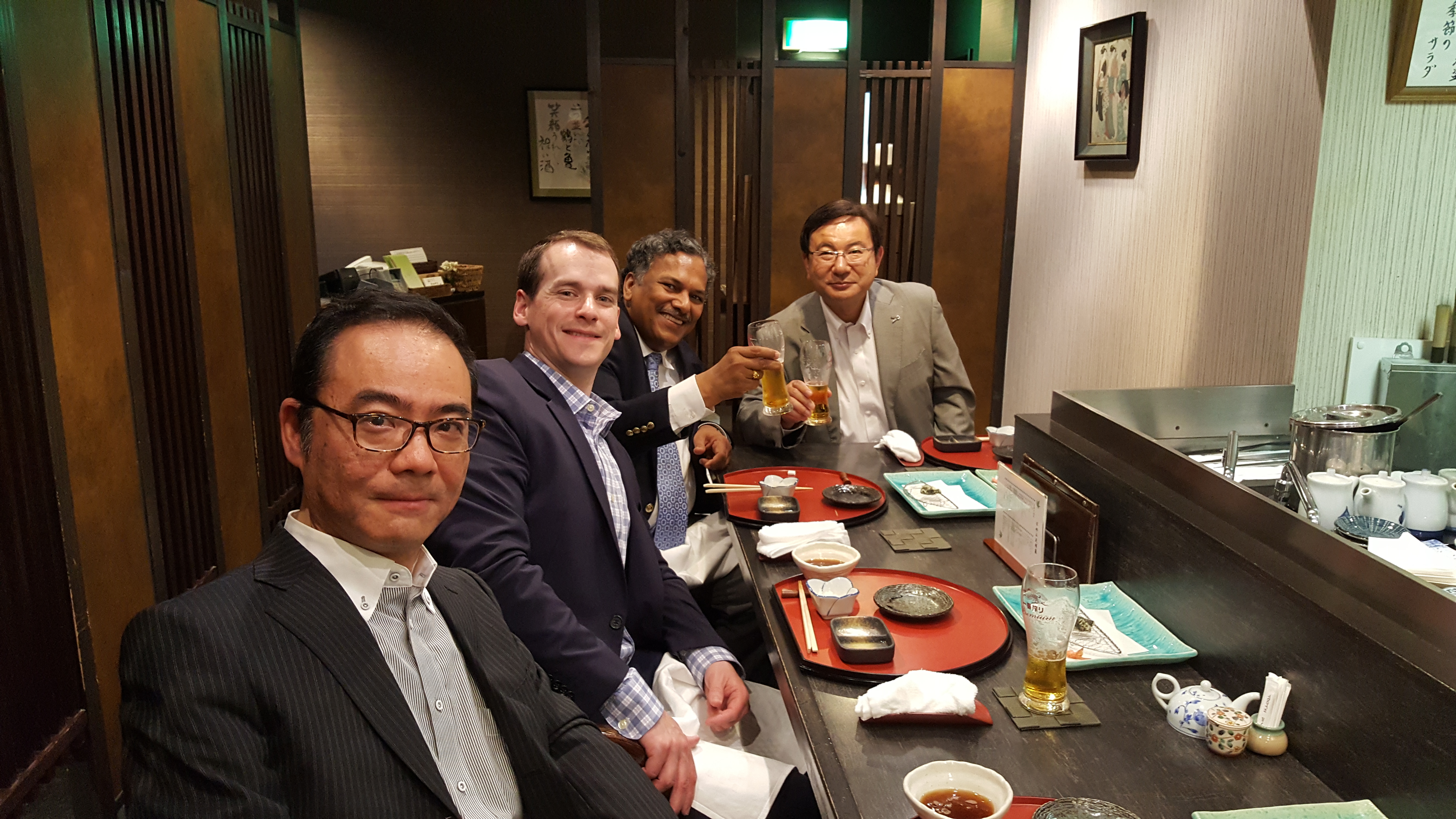 Professor Dravid, JEOL USA's Patrick Phillips and two Japanese JEOL executives enjoy beers and a casual dinner