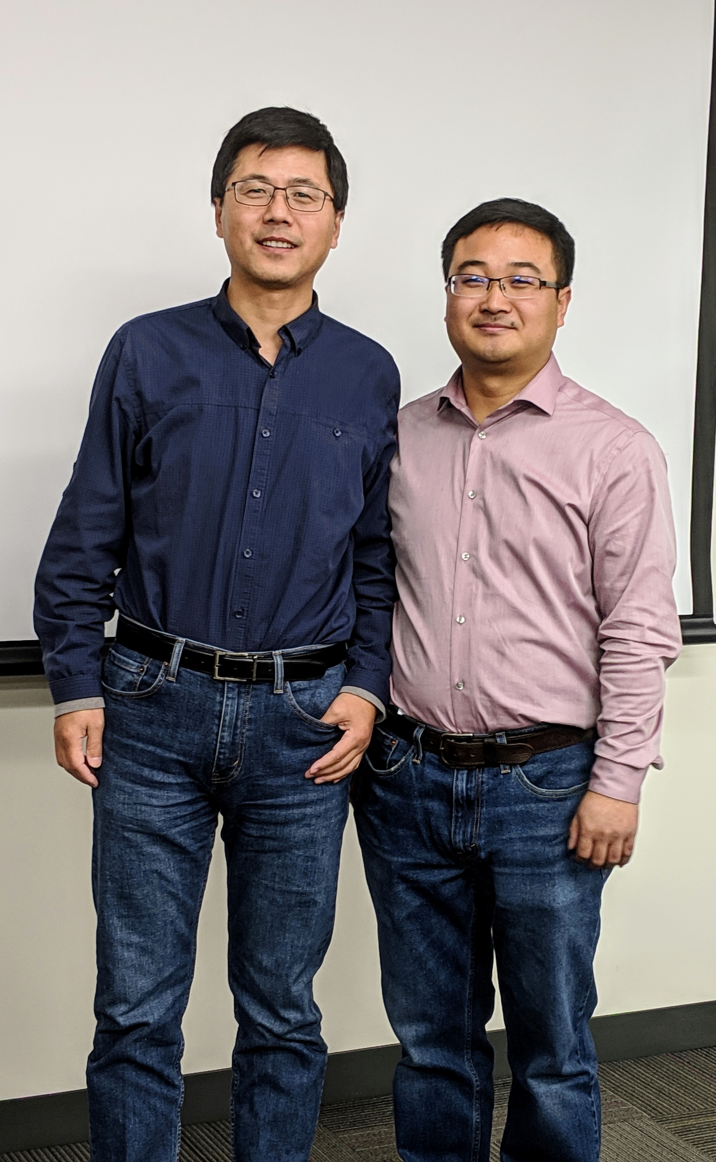Dr. Li stands with his mentor, Dr. Xinqi Chen.